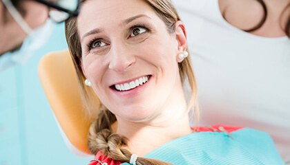 Female patient smiling in dental chair